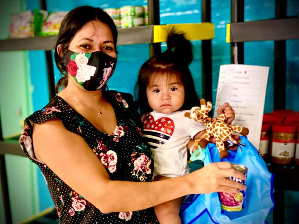 A mother and daughter at the Mission Food Pantry