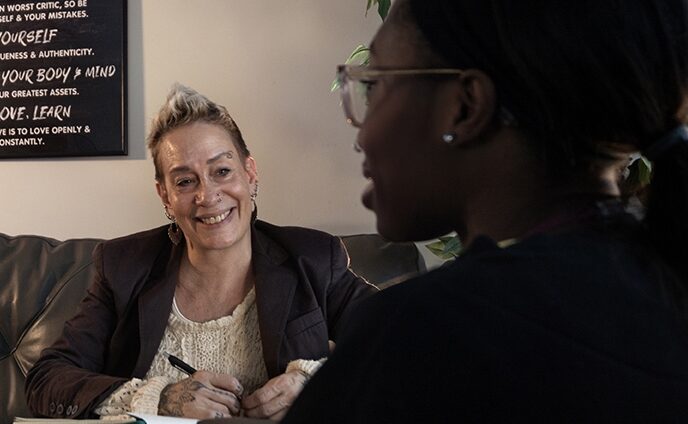 Leticia welcoming a member to a counseling session